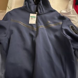 Brand new Nike tech too small for my man.